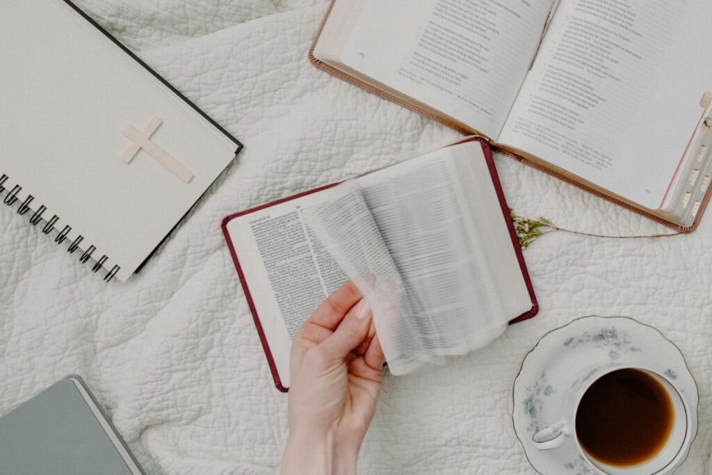 Home A cozy setup of Bible reading with a cup of coffee, evoking a peaceful morning routine.